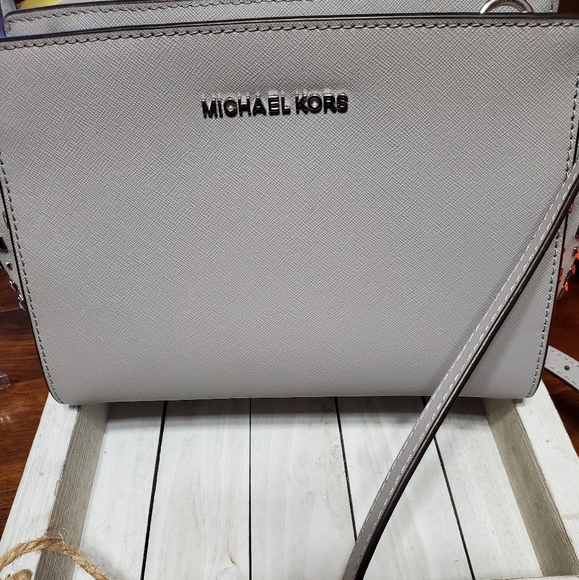Michael Kors Handbags - Michael Kors gray crossbody with studs details.